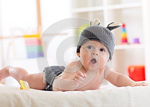 Portrait of a cute 5 months baby wearing rabbit hat
