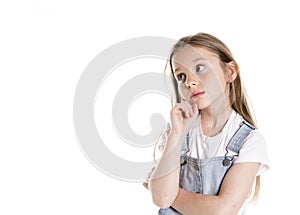 Portrait of a cute 7 years old girl Isolated over white background pensive