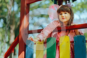 Portrait of a Cute Adorable Girl at the Playground Having Fun
