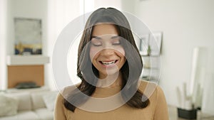 Portrait of cute adorable girl sincerely smiling and laughing, looking at camera