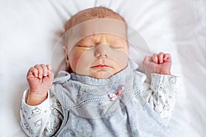 Portrait of cute adorable newborn baby girl sleeping