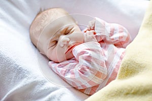 Portrait of cute adorable newborn baby girl sleeping