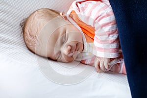 Portrait of cute adorable newborn baby girl sleeping
