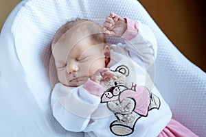 Portrait of cute adorable newborn baby girl sleeping