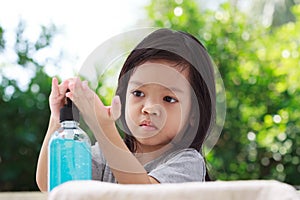 Portrait cute Asian girl aged 4 to 8 years old, washing her hands with soap from the tap. To clean her hands Frequent hand washing