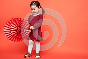 Little girl with paper fans