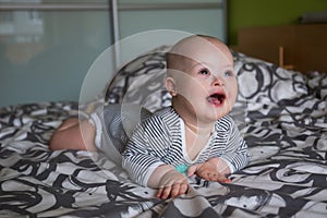 Portrait of cute baby boy with Down syndrome