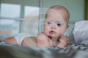 Portrait of cute baby boy with Down syndrome