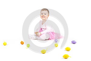 Portrait of a cute baby with Easter eggs