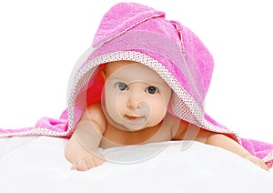 Portrait of cute baby under the pink towel