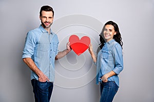 Portrait of cute beautiful spouses people enjoying trusting respecting holding huge valentine paper card satisfied