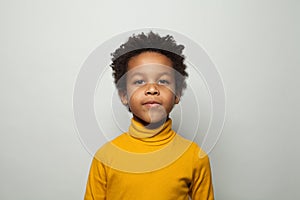 Portrait of cute black kid boy smiling on white background