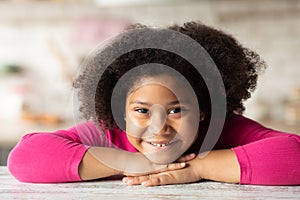 Portrait Of Cute Black Little Curly Girl Smiling At Camera, Closeup Shot