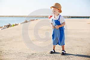 Portrait of a cute blond boy in hat