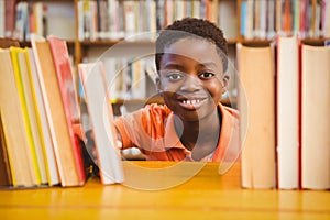 Portrait of cute boy in library