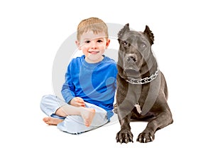 Portrait of cute boy sitting with a dog