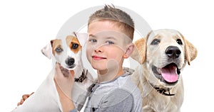 Portrait of a cute boy with two dogs