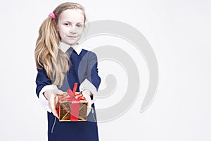 Portrait of cute Caucasian Blond Kid with Gift. Against White Ba