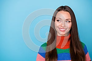 Portrait of cute charming girl look copyspace flirt guy wear rainbow jumper isolated over blue color background