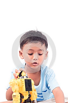 Portrait of cute child asian little boy playing robot