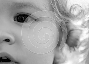 Portrait of a cute child baby. Close up caucasian kids macro cropped face. Closeup head of funny kid.