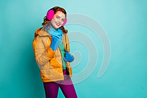 Portrait of cute content woman enjoy warm clothing rest relax touch her outercoat good look wear casual clothing weather