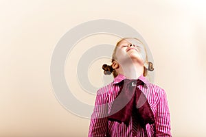 Portrait of cute elegant redhead girl looking up c