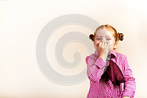 Portrait of cute elegant redhead girl mouth covere