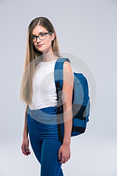 Portrait of a cute female teenager with backpack