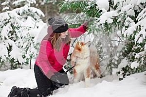 Portrait with a cute fluffy puppy. Winter walk with a dog.