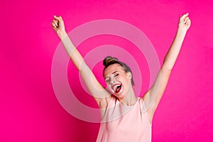 Portrait of cute funny funky thrilled lady celebrate championship positive expression scream shout raise fists yeah photo