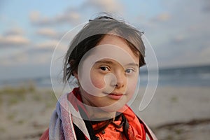 Portrait of a cute girl in the background of the sea