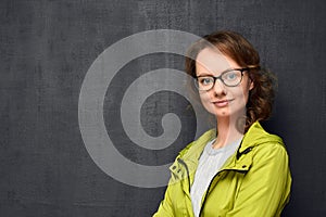 Portrait of cute girl with eyeglasses, copy space on left