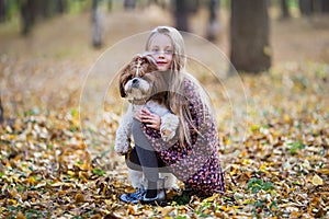 Portrait of a cute girl with her beloved dog