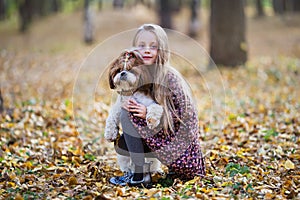 Portrait of a cute girl with her beloved dog photo