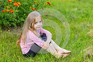 Portrait of a cute girl with long blond hair