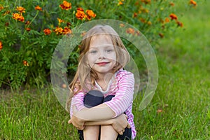 Portrait of a cute girl with long blond hair