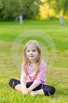 Portrait of a cute girl with long blond hair