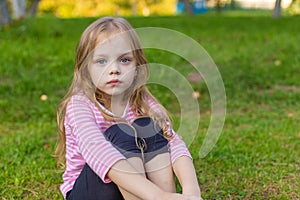 Portrait of a cute girl with long blond hair