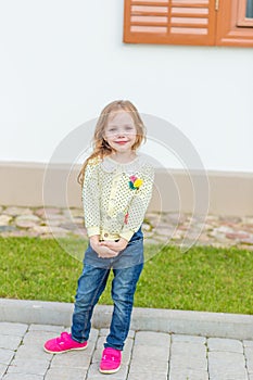 Portrait of a cute girl with long blond hair