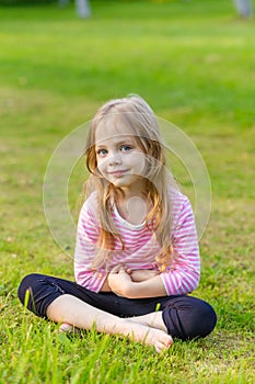 Portrait of a cute girl with long blond hair