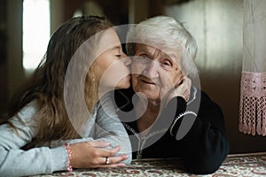 Portrait of a cute girl together with her beloved Granny