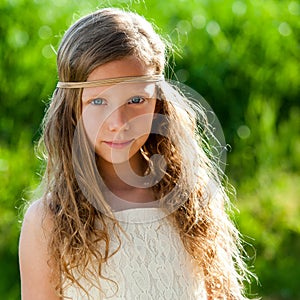 Portrait of cute girl wearing ribbon headband.