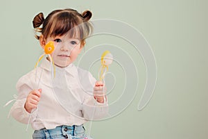 Portrait of cute happy baby girl playing with easter decorations