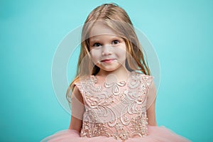 Portrait of cute happy charming little girl in princess dress