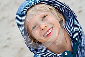 Portrait of cute, happy child at the beach