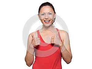 Portrait of cute happy woman showing thumbs up