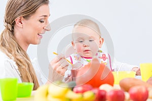 Portrait of a cute and healthy baby girl looking with curiosity