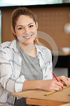 Portrait cute hispanic female carpenter