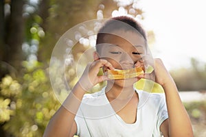 Portrait of cute kid in imagines some yummy food with eyes.